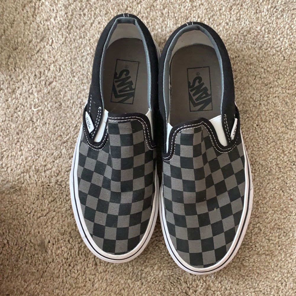 Black and grey checkered slip on vans